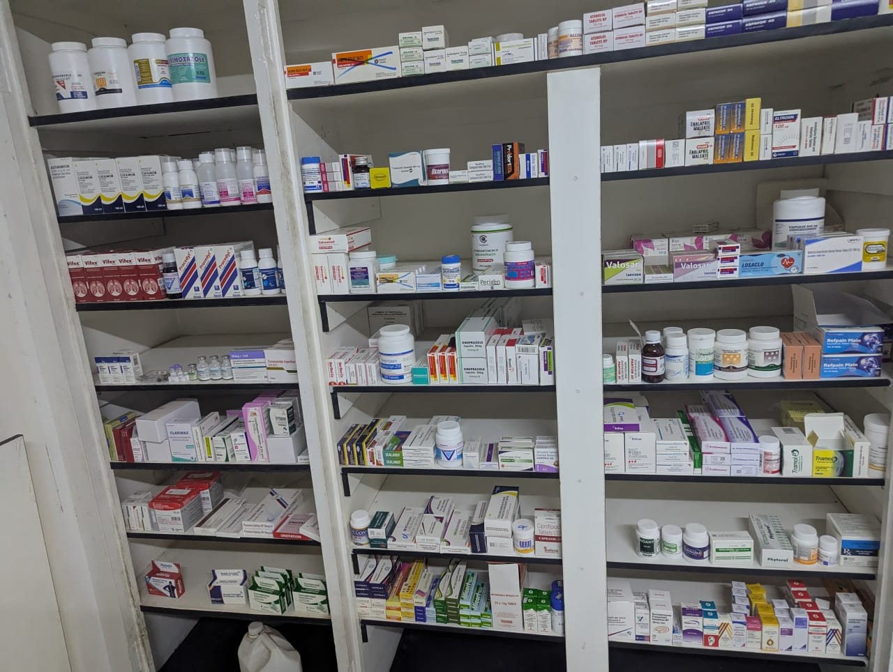 Fully-stocked pharmacy shelves